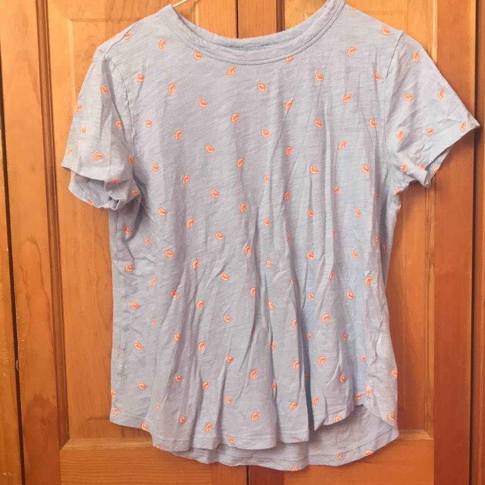 light blue top with oranges design